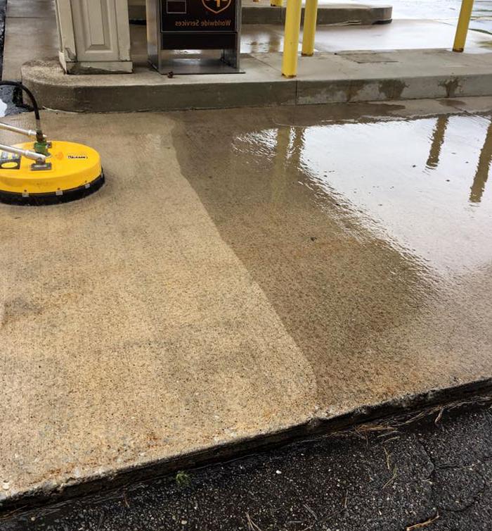 cleaning a concrete pad on a commercial driveway in grand rapids, mi